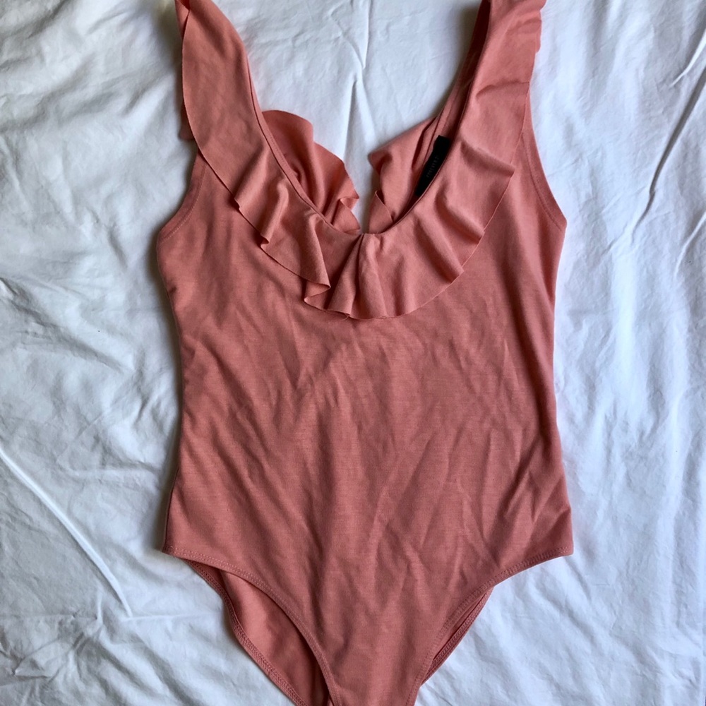 Body suit with ruffles